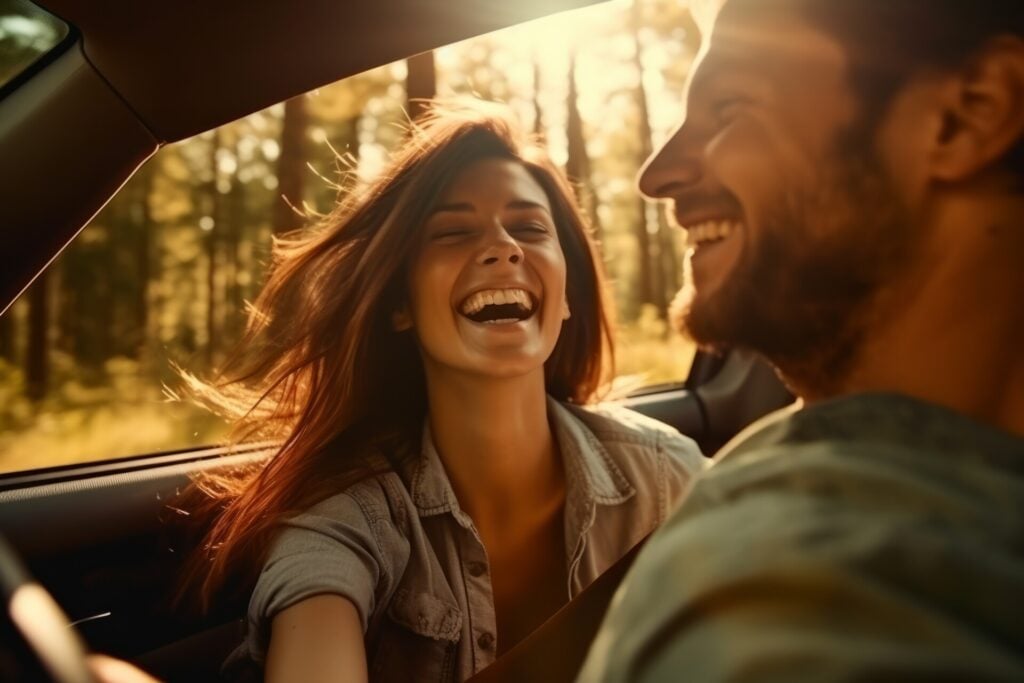 a man and a woman go on a trip in a car. having fun. smiling.